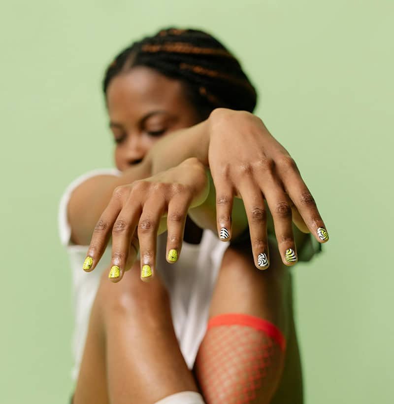 Black girl with nail polish on fingers